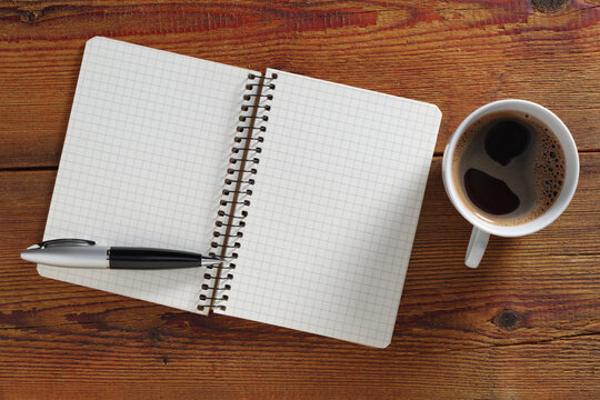 Notebook, pen, and coffee top view
