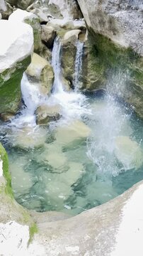 Refreshing Mountain Stream with Splashing Water in Vertical Format