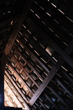 Old Wooden Roof Frame with Light Streaming Through