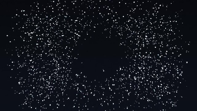Abstract explosion of white particles on a black background