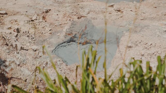 Close-up of a bubbling mud pit at Saint Lucia's Sulphur Springs, where volcanic activity churns beneath the earth in the world's only drive-in volcano.
