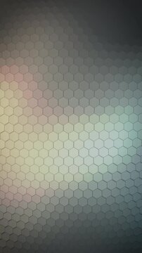 A glowing hexagon membrane shifts through warm gold and cool teal light in a vertical loop, offering a versatile abstract backdrop for tech reels and wellness marketing.