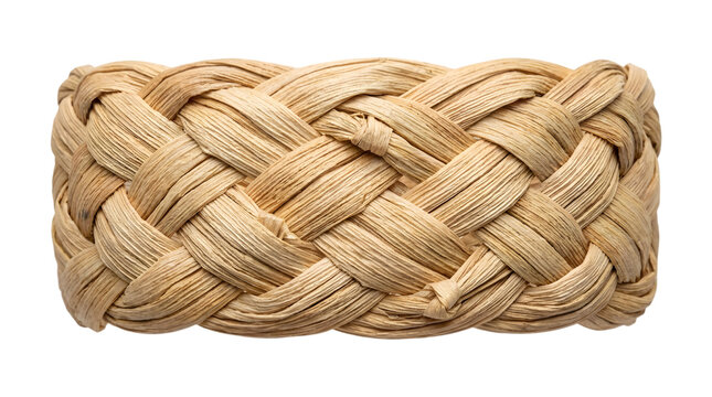 A close up view of a decorative braided straw texture with natural patterns