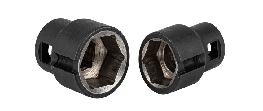 Impact socket wrench head tools for mechanic auto repair and hardware maintenance isolated on black background for industrial engineering and heavy duty steel machinery equipment construction work.
