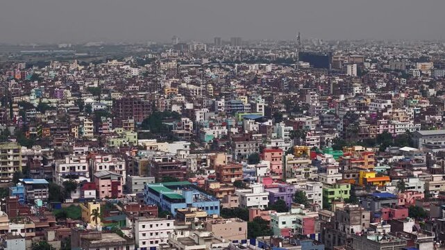 Aerial view of Patna, Bihar, India, showcasing the dense urban landscape, residential buildings, modern infrastructure, and busy roads of the city. Patna's rapid urban development