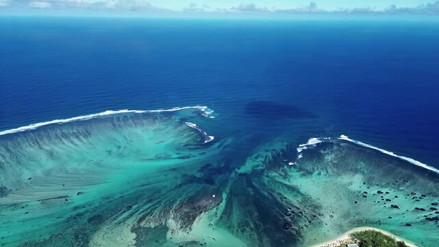Aerial view of majestic underwater waterfall illusion at le morne brabant in mauritius island.