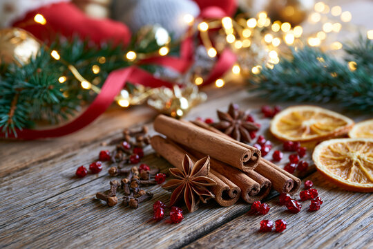 Bright and festive still life of rich Christmas spices on a wooden table Generative AI