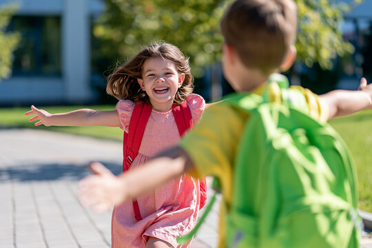 Joyful reunion of friends under bright sunshine during school break in a lively park setting Generative AI