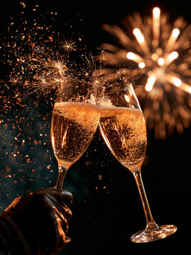 Celebrate the arrival of the new year with sparkling glasses and joyous fireworks lighting up the night Generative AI