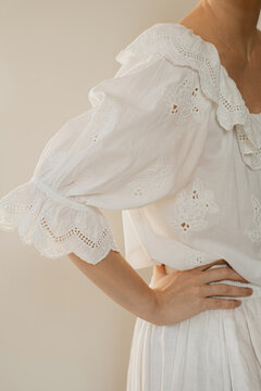 Elegant Woman Posing In Sustainable White Linen And Cotton Clothing