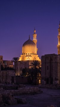 Illuminated mosque dome at night in Cairo