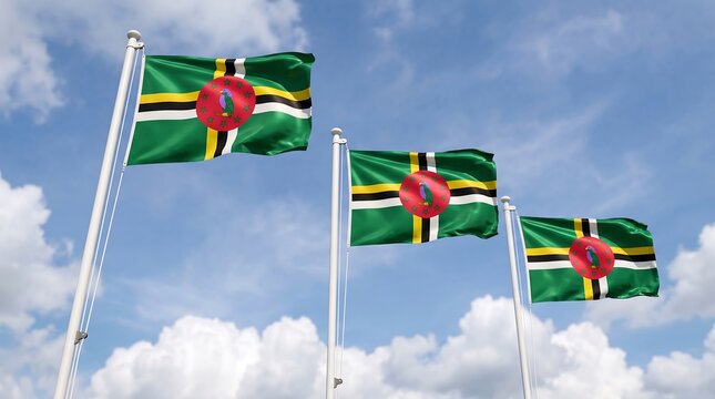 Three national flags of Dominica waving on poles against a blue sky with soft white clouds