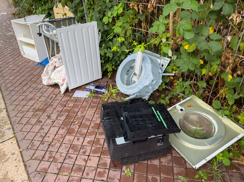 Scrap Metal and Bulky Waste on a City Footpath &ndash; Illegal Dumping and Urban Waste Disposal Problem