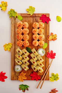 Baked and tempura sushi set with autumn leaves