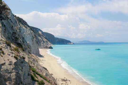 Dramatic cliffs towering over a beautiful turquoise sea