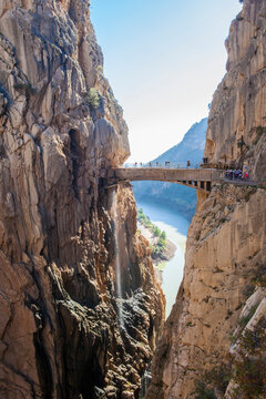 Visitors crossing the suspension bridge at Caminito del Rey Path