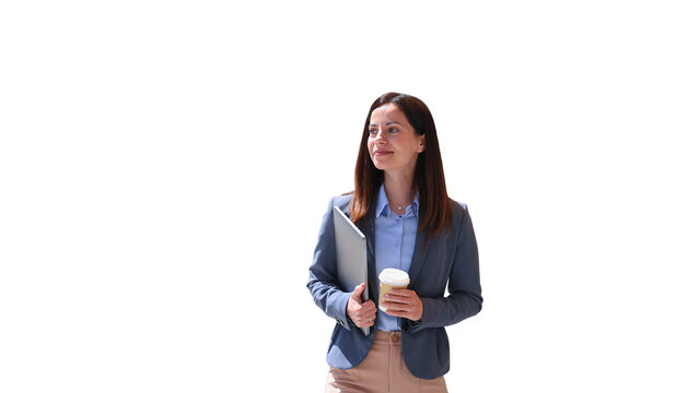 Professional businesswoman holding laptop and coffee looking away
