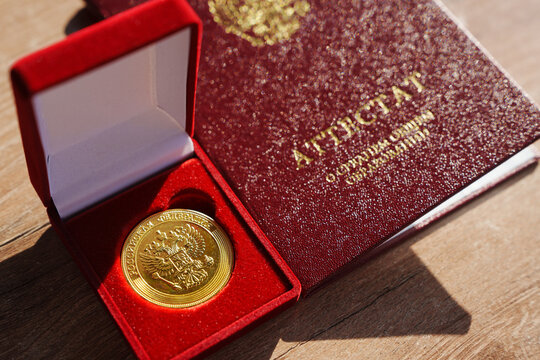2026.06.23, Russia, Gold School Medal displaying Russian Emblem beside Diploma