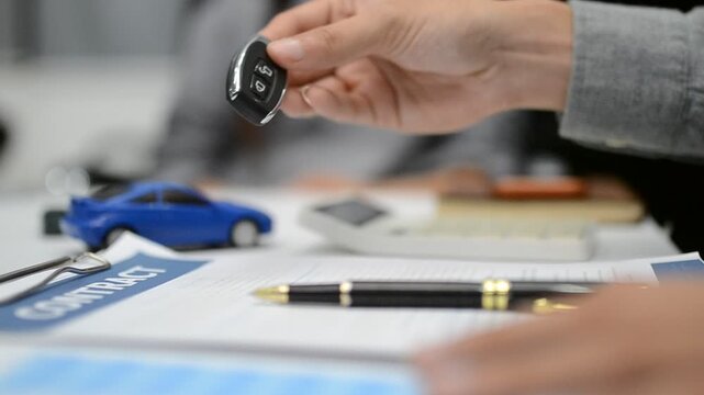 Woman signing auto insurance contract with agent after car crash claim. Trustworthy vehicle protection, policy coverage, and financial deal.