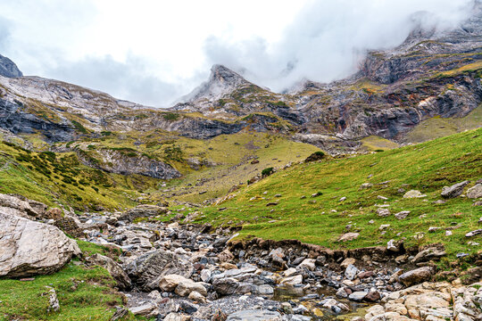 Hiking trail in Cirque de Troumouse at Heas in the Hautes-Pyrenees department in France, forming the border with Spain