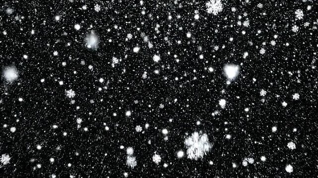 Realistic falling snow overlay on black background, winter weather effect for cinematic compositions and holiday motion