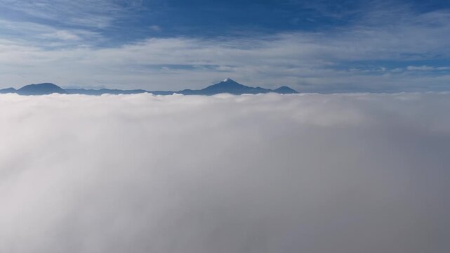 Aerial view of clouds covering pico de Orizaba volcano in Mexico
