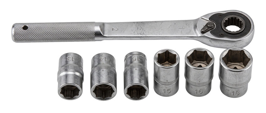Socket wrench set ratchet tool with chrome metal socket heads isolated on black background for professional mechanic repair work automotive maintenance equipment fixing DIY hardware manual workshop