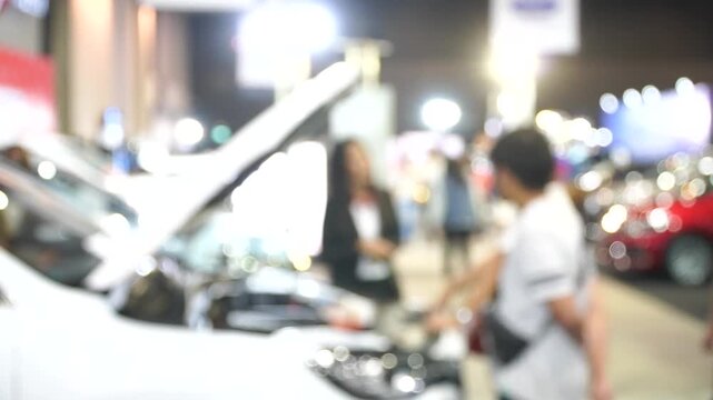 A motor show is a public exhibition that showcases current automobile models, debut concepts, and groundbreaking automotive technologies.Blur and Soft Focus.