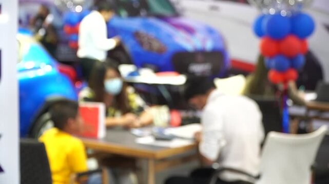 A motor show is a public exhibition that showcases current automobile models, debut concepts, and groundbreaking automotive technologies.Blur and Soft Focus.