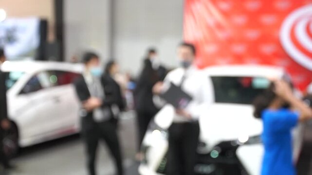 A motor show is a public exhibition that showcases current automobile models, debut concepts, and groundbreaking automotive technologies.Blur and Soft Focus.