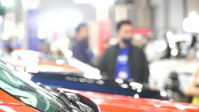 A motor show is a public exhibition that showcases current automobile models, debut concepts, and groundbreaking automotive technologies.Blur and Soft Focus.