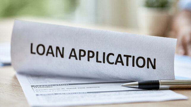 Close-up of a Loan Application document with a pen, symbolizing financial approval and borrowing