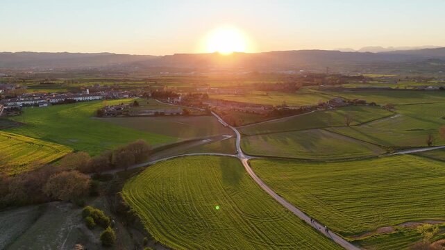 Sunset over the countryside. Breathtaking views from above. Natural beauty captured in aerial footage. Explore serene landscapes and vibrant colors in this picturesque scene.