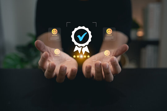Hands presenting digital verified quality badge with glowing star rating and smiley face icons concept
