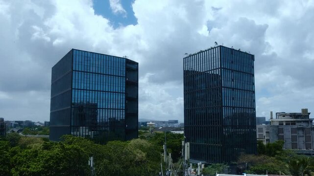 Fast cloud moving timelapse around Modern Glass Office Buildings with Dramatic Monsoon Clouds in Mumbai, India
