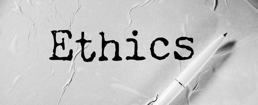 Ethics word on white paper
