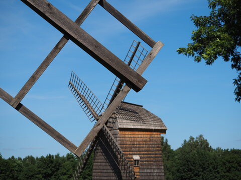 Wooden structure and a windmill in the background