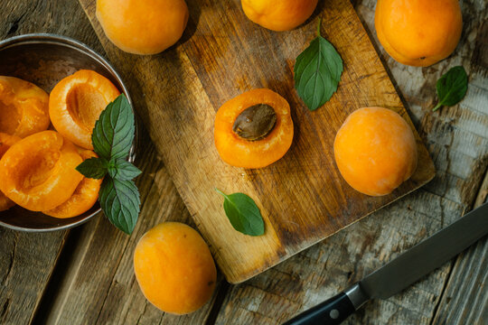Fresh ripe apricots on rustic background