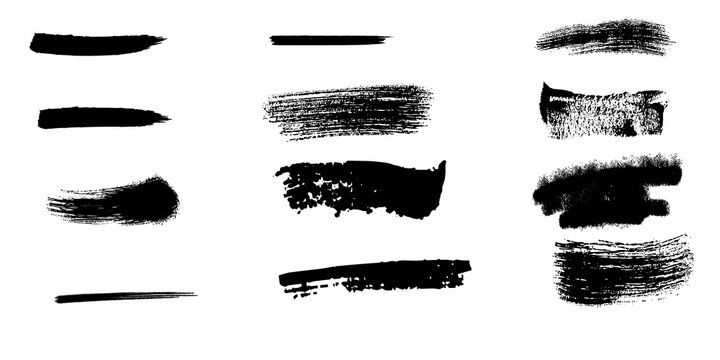 Set of various black ink brush strokes and charcoal textures isolated on a plain white background