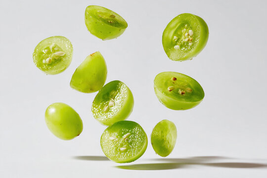 Freshly cut grape pieces suspended in motion