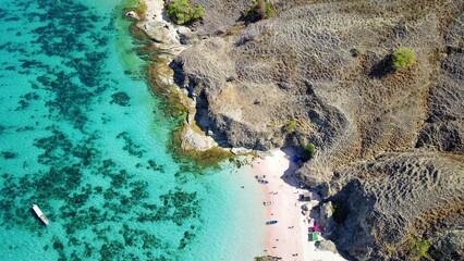 Drone Aerial View of Tropical Pink Sand Beach with Clear Blue Water © rhpermana