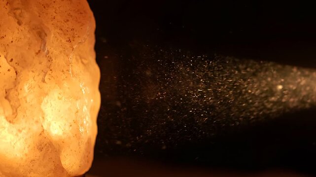 Dust Motes Drifting in the Warm Glow of a Salt Lamp