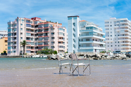 Two empty chairs in the sea