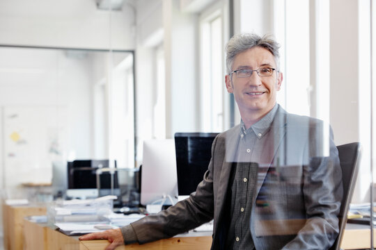 Mature businessman working in office