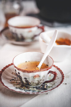 Ayurvedic turmeric tea spiced with pepper in a vintage cup