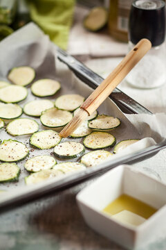 Slices of courgettes on baking tray