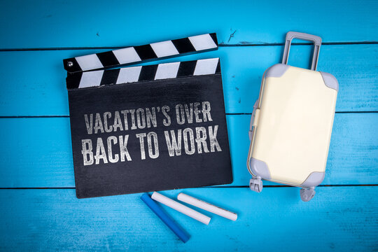 VACATION&rsquo;S OVER BACK TO WORK Message Beside Suitcase and Clapperboard