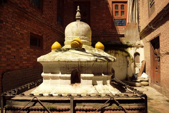 Buddhist stupa at a traditional temple courtyard in Nepal