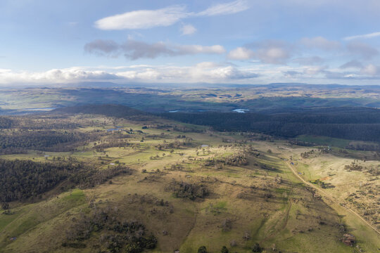rolling green farmlands, country roads, and dams in a scenic Australian valley summer