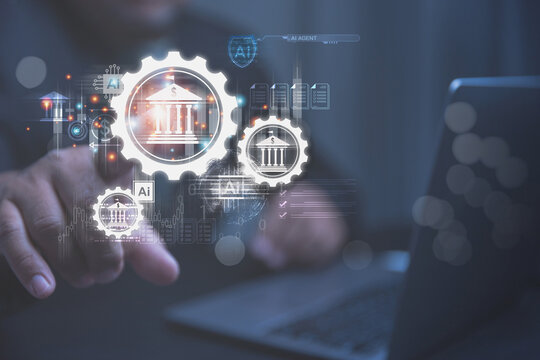 A person uses a laptop to manage digital banking systems with the help of artificial intelligence. Futuristic gears and bank icons glow on a screen to show smart financial technology.